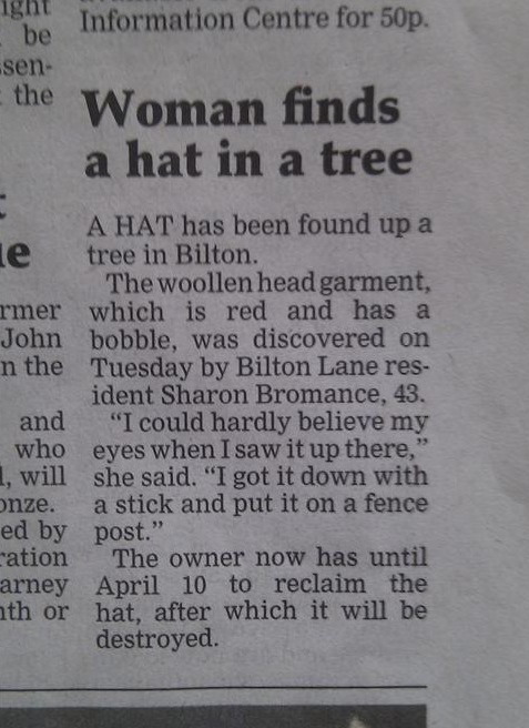 Woman finds hat in a tree