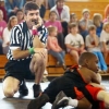 Kids wrestling referee daydreaming